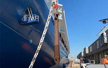 Anchor lifted by crane